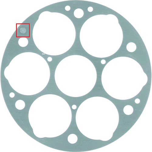 Defect example: Metal gasket with a dent (red).