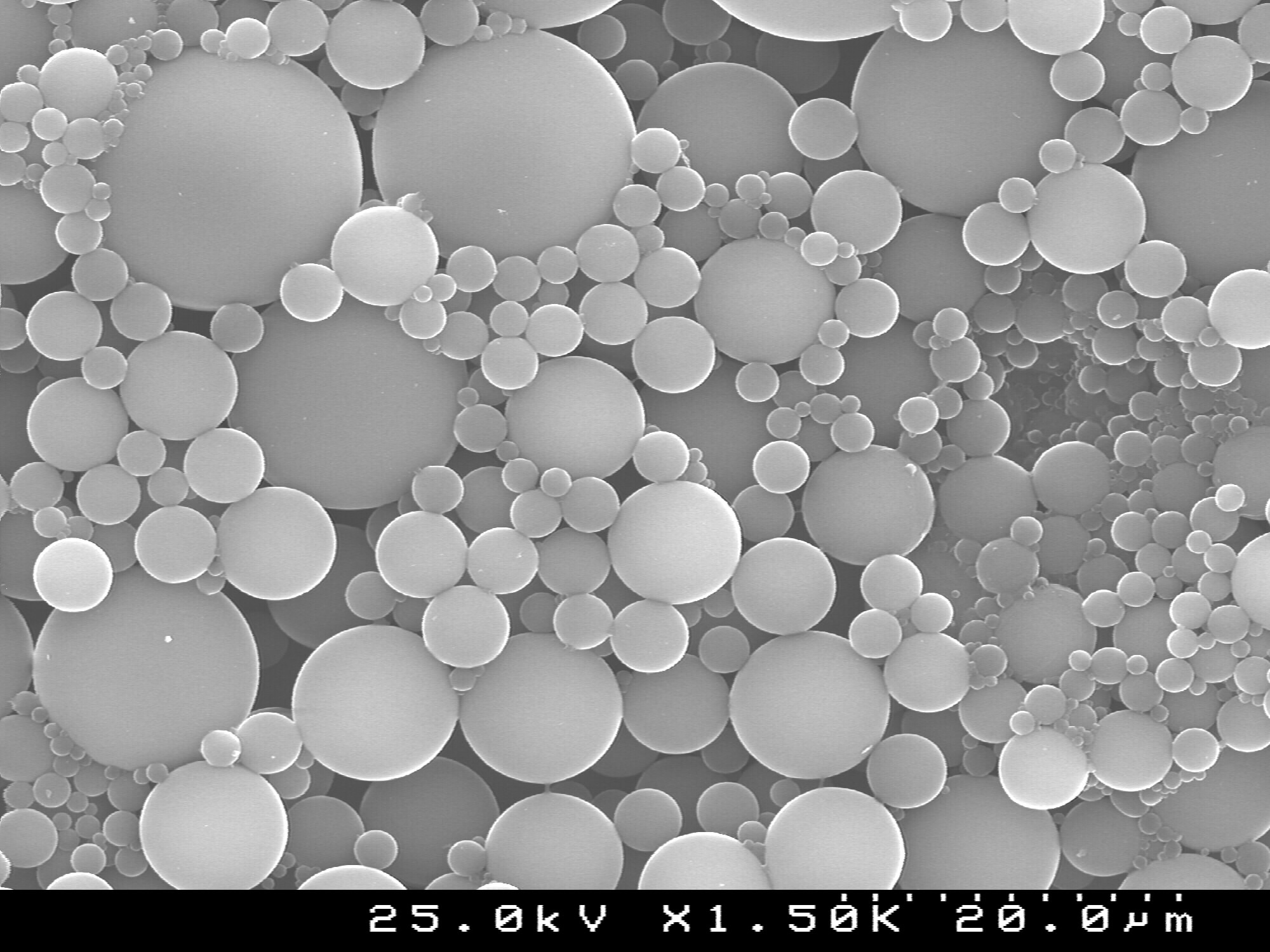 SEM picture of polymeric microcapsules loaded with corrosion inhibitor produced by Smallmatek at pilot scale.